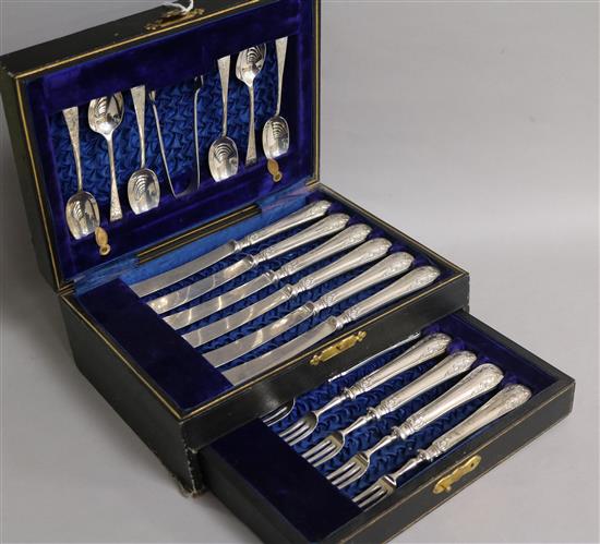 A cased late Victorian nineteen piece dessert set, comprising dessert eaters, teaspoons and sugar tongs,